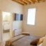 Double bedroom with shelf above the bed for emptying pockets, wardrobe, private bathroom in the room.